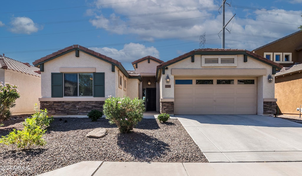 view of front of property with a garage