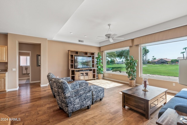 living room featuring hardwood / wood-style floors, plenty of natural light, and ceiling fan