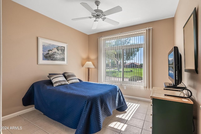 bedroom with light tile patterned floors and ceiling fan