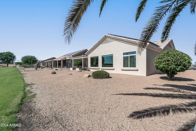 rear view of house with a patio