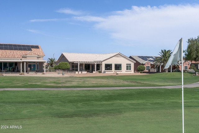 view of home's community with a yard