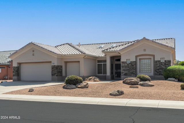 mediterranean / spanish-style house featuring a garage