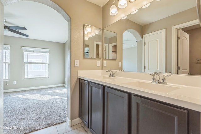 bathroom featuring tile patterned floors, ceiling fan, and vanity