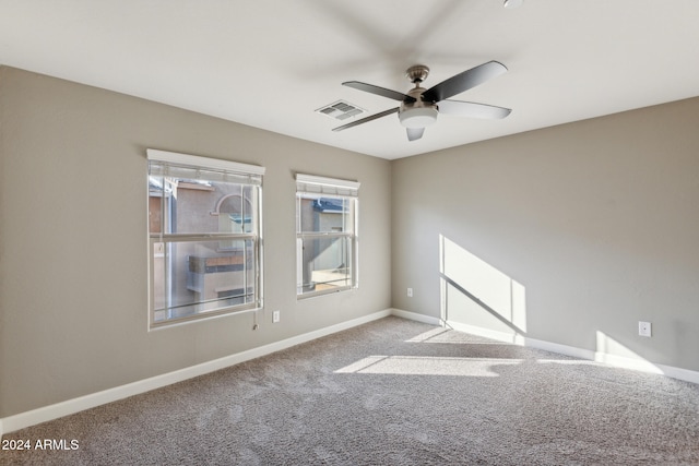 empty room with carpet and ceiling fan