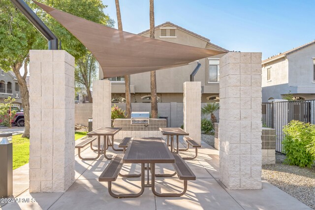 view of patio / terrace featuring area for grilling and exterior kitchen