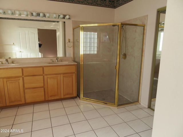 bathroom with tile patterned flooring, vanity, and a shower with shower door