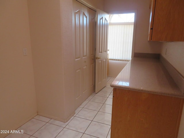 kitchen with light tile patterned floors