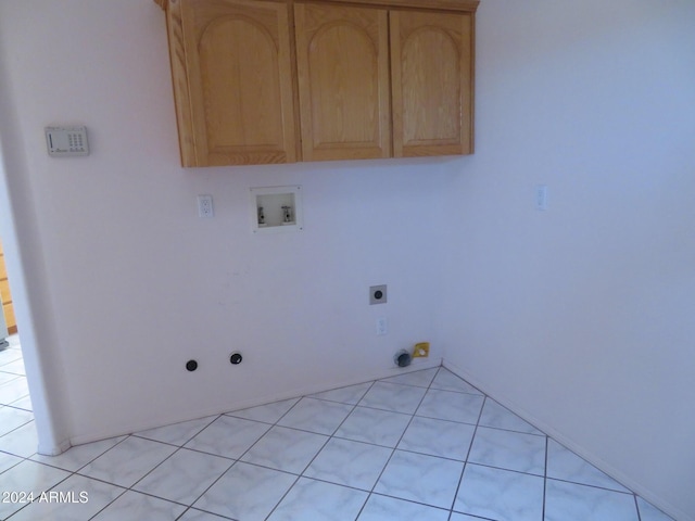 washroom with washer hookup, light tile patterned floors, gas dryer hookup, and electric dryer hookup