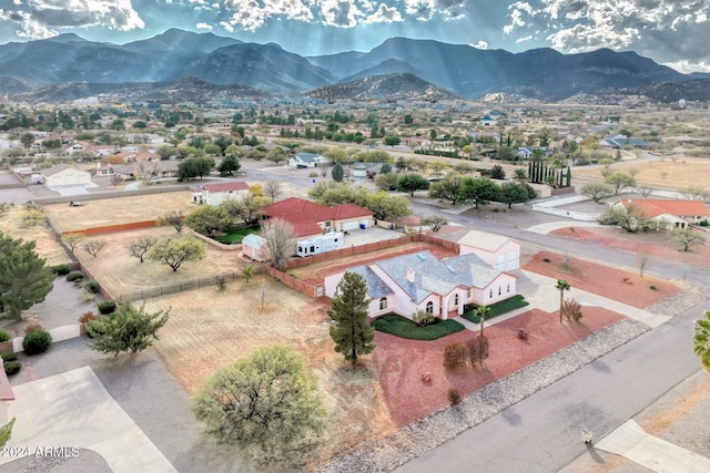 birds eye view of property featuring a mountain view