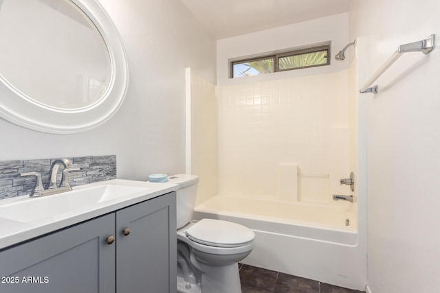 full bathroom featuring tile patterned flooring, toilet, vanity, and  shower combination