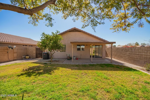 back of property featuring central AC, a yard, and a patio