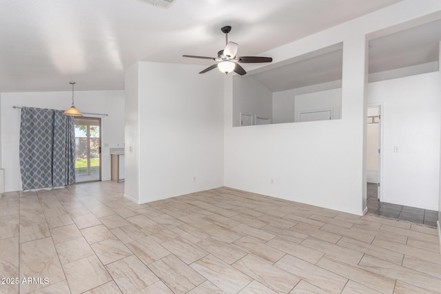 spare room featuring ceiling fan and vaulted ceiling