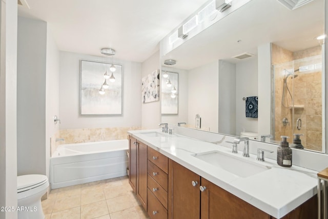 full bathroom with tile patterned flooring, vanity, toilet, and separate shower and tub