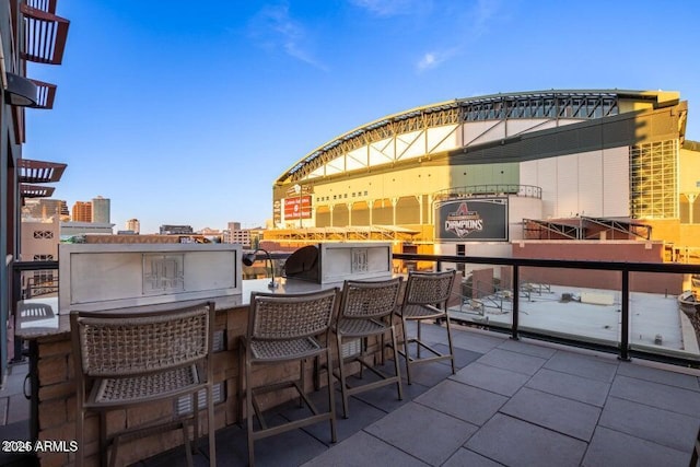 view of patio with an outdoor bar