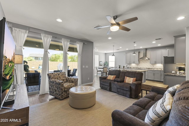 18865 W Mescal St, Surprise, AZ 85388 - living area featuring a ceiling fan, light wood-style flooring, and recessed lighting