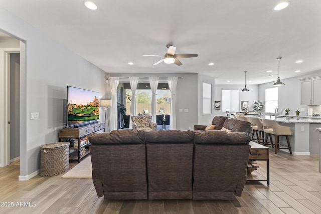 18865 W Mescal St, Surprise, AZ 85388 - living room featuring ceiling fan, light wood-type flooring, and recessed lighting