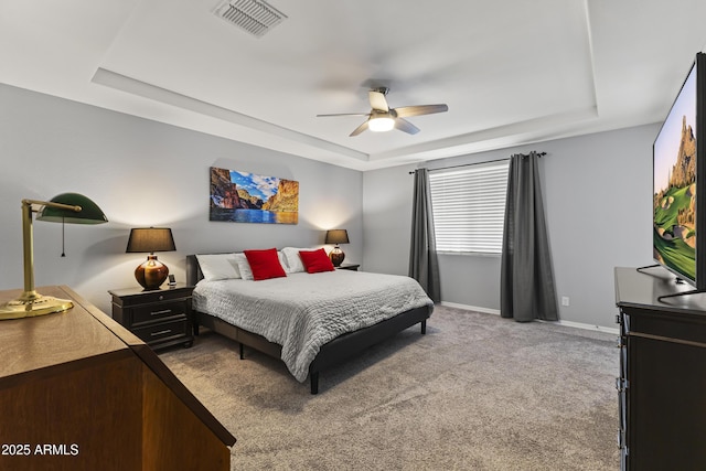 18865 W Mescal St, Surprise, AZ 85388 - carpeted bedroom featuring a tray ceiling and a ceiling fan