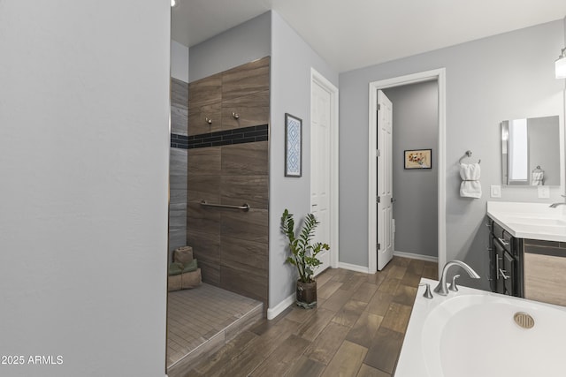 18865 W Mescal St, Surprise, AZ 85388 - bathroom featuring vanity, a tile shower, wood finished floors, and a bath