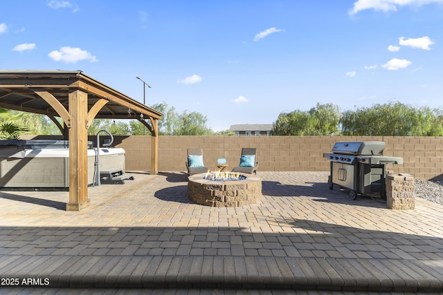 18865 W Mescal St, Surprise, AZ 85388 - view of patio featuring a grill, a hot tub, a fire pit, and a gazebo
