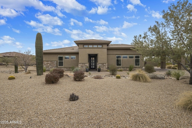 prairie-style house with stucco siding and stone siding