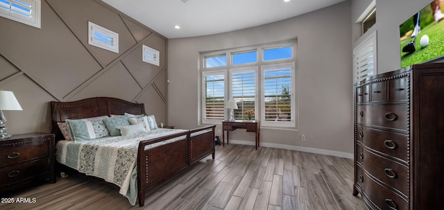 bedroom featuring recessed lighting, baseboards, and light wood finished floors