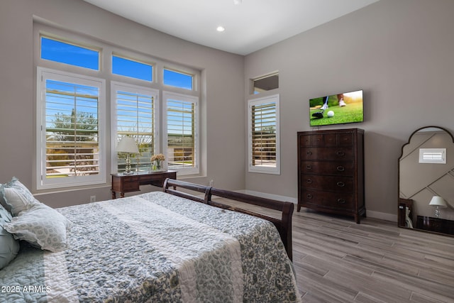 bedroom featuring recessed lighting, baseboards, and wood finished floors