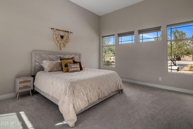 bedroom with carpet and baseboards