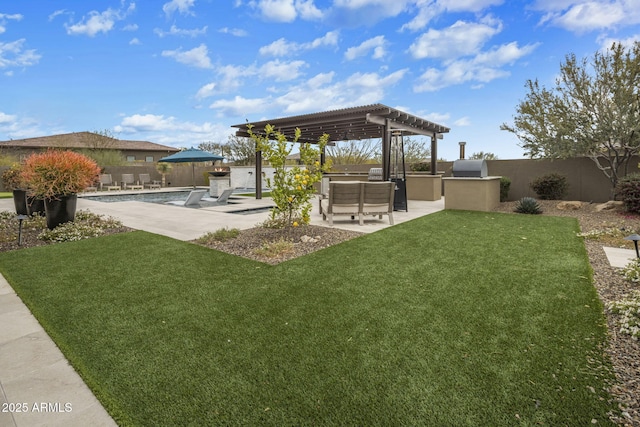 view of yard featuring a patio area, a pergola, exterior kitchen, and a fenced backyard