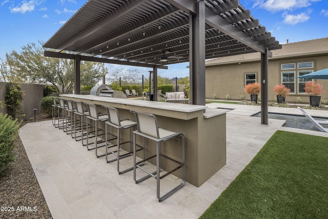 view of patio with a pergola, an outdoor bar, a ceiling fan, and fence