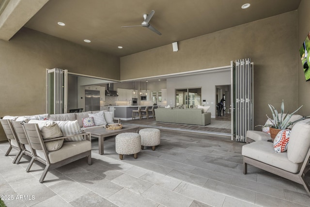 view of patio with an outdoor hangout area and a ceiling fan