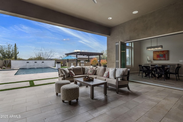 view of patio / terrace featuring outdoor dining space, an outdoor hangout area, and a pergola