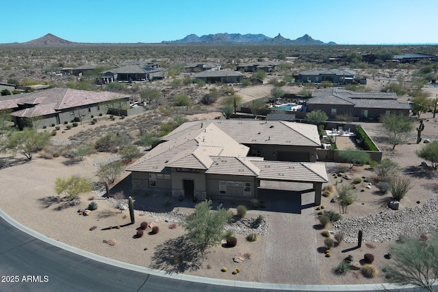 drone / aerial view featuring a mountain view and a residential view