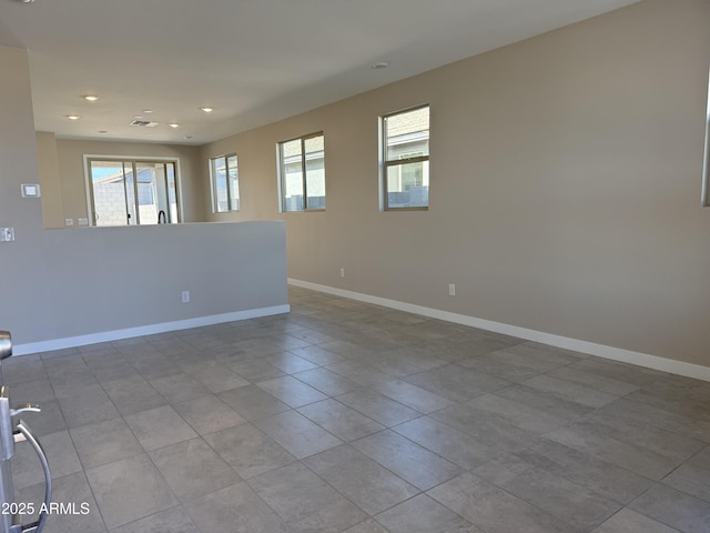23214 W Miami St, Buckeye, AZ 85326 - tiled empty room featuring baseboards and recessed lighting