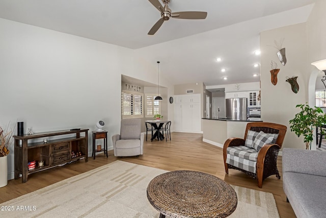 6017 E Kathleen Rd, Scottsdale, AZ 85254 - living room featuring light wood-type flooring, ceiling fan, and lofted ceiling