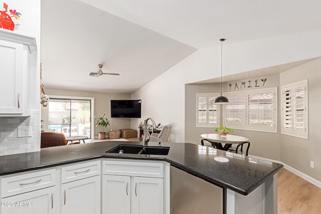 6017 E Kathleen Rd, Scottsdale, AZ 85254 - kitchen featuring dishwasher, white cabinetry, lofted ceiling, light wood-style floors, and dark stone countertops