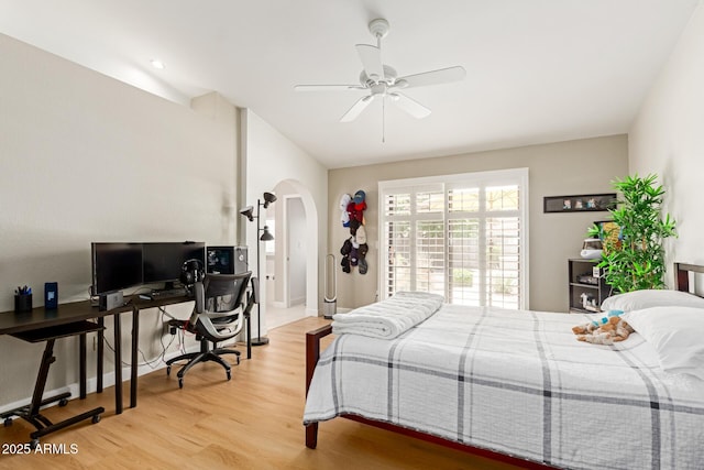 6017 E Kathleen Rd, Scottsdale, AZ 85254 - bedroom featuring arched walkways, light wood finished floors, a desk, and a ceiling fan