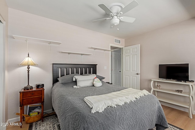 6017 E Kathleen Rd, Scottsdale, AZ 85254 - bedroom with wood finished floors and a ceiling fan