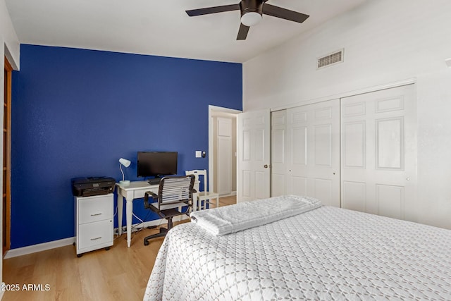 6017 E Kathleen Rd, Scottsdale, AZ 85254 - bedroom with a closet, light wood-type flooring, a towering ceiling, and ceiling fan
