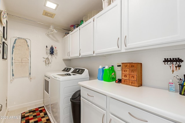 6017 E Kathleen Rd, Scottsdale, AZ 85254 - washroom featuring cabinet space, washer and clothes dryer, and tile patterned flooring