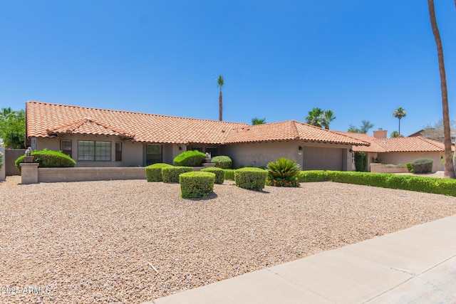 6017 E Kathleen Rd, Scottsdale, AZ 85254 - view of front facade with a garage, stucco siding, a tiled roof, and driveway