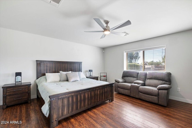 bedroom with ceiling fan and dark wood-type flooring