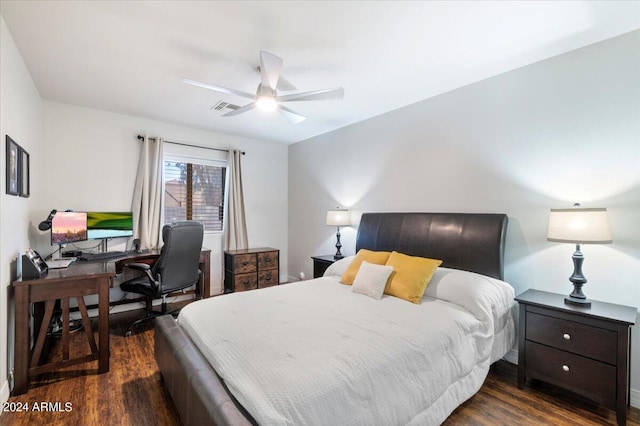 bedroom with ceiling fan and dark hardwood / wood-style floors