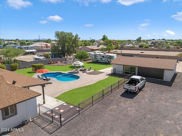 view of swimming pool with a yard and a patio area