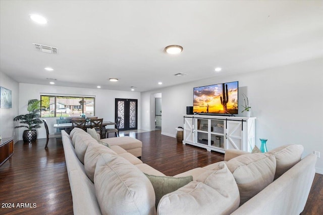 living room with dark hardwood / wood-style flooring