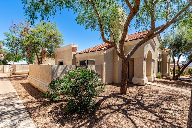 1111 W Summit Pl Unit 85, Chandler, AZ 85224 - view of front of property with stucco siding, a tile roof, and fence