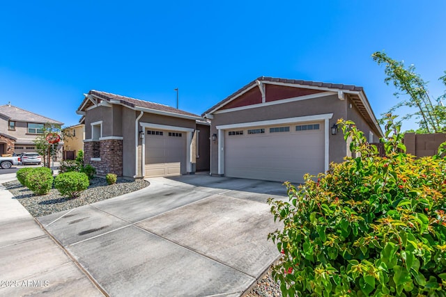 4077 S Quinn Ave, Gilbert, AZ 85297 - single story home featuring driveway, a tile roof, a garage, stone siding, and stucco siding