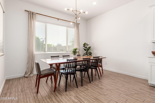 4077 S Quinn Ave, Gilbert, AZ 85297 - dining space featuring baseboards, light wood finished floors, and a chandelier
