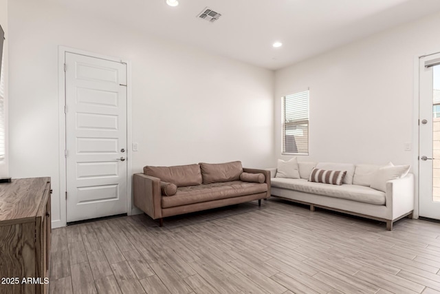 4077 S Quinn Ave, Gilbert, AZ 85297 - living area with a healthy amount of sunlight, recessed lighting, and light wood-type flooring