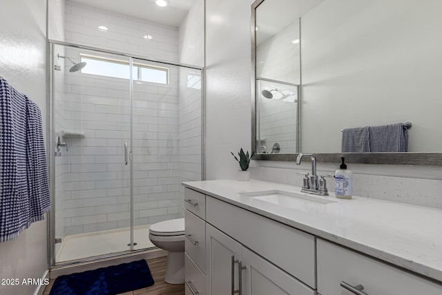 4077 S Quinn Ave, Gilbert, AZ 85297 - bathroom featuring vanity, a stall shower, toilet, and wood finished floors