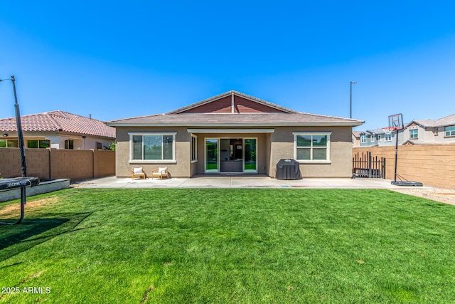 4077 S Quinn Ave, Gilbert, AZ 85297 - rear view of house with a lawn, a patio, a fenced backyard, and stucco siding